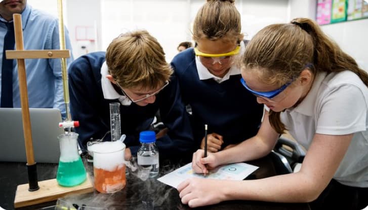 Students conducting a science experiment in a classroom
